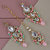 LUCKY JEWELLERY Designer Gold Plated Kundan Pink Mint Color Tika Earring Set for Girls  women (320-ME2K-1812-PKMNT)