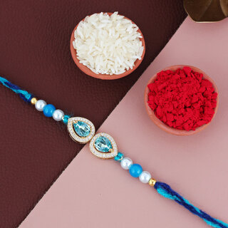 LUCKY JEWELLERY Turquoise Stone Pearl Rakhi for Brother/Bhaiya/Bhai/Bhabhi - Pack of 1