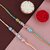 LUCKY JEWELLERY Multi PearlRakhi for Brother/Bhaiya/Bhai/Bhabhi - Pack of 2